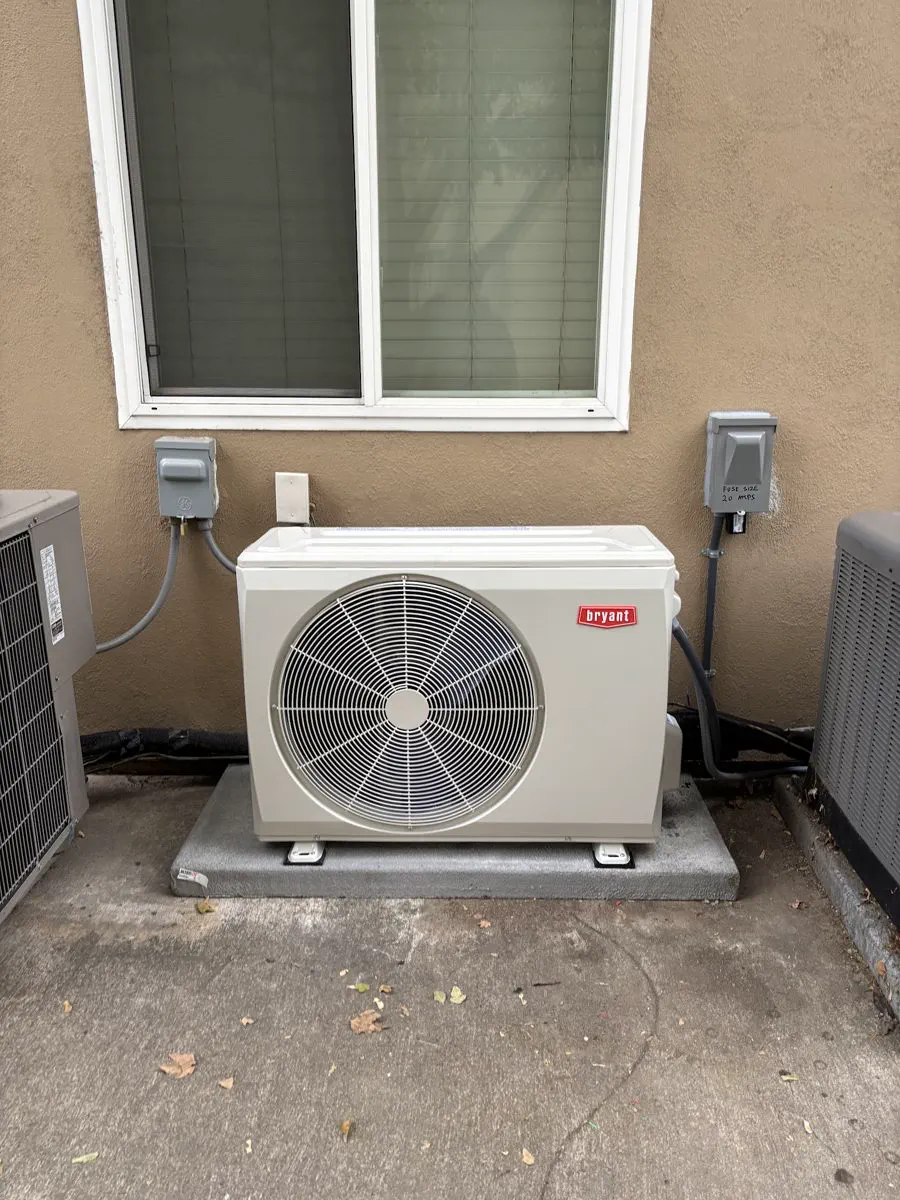 A Bryant ductless mini-split outdoor unit mounted on a pad