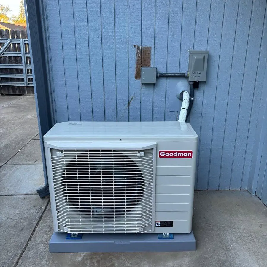A Goodman ductless mini-split outdoor unit on a pad